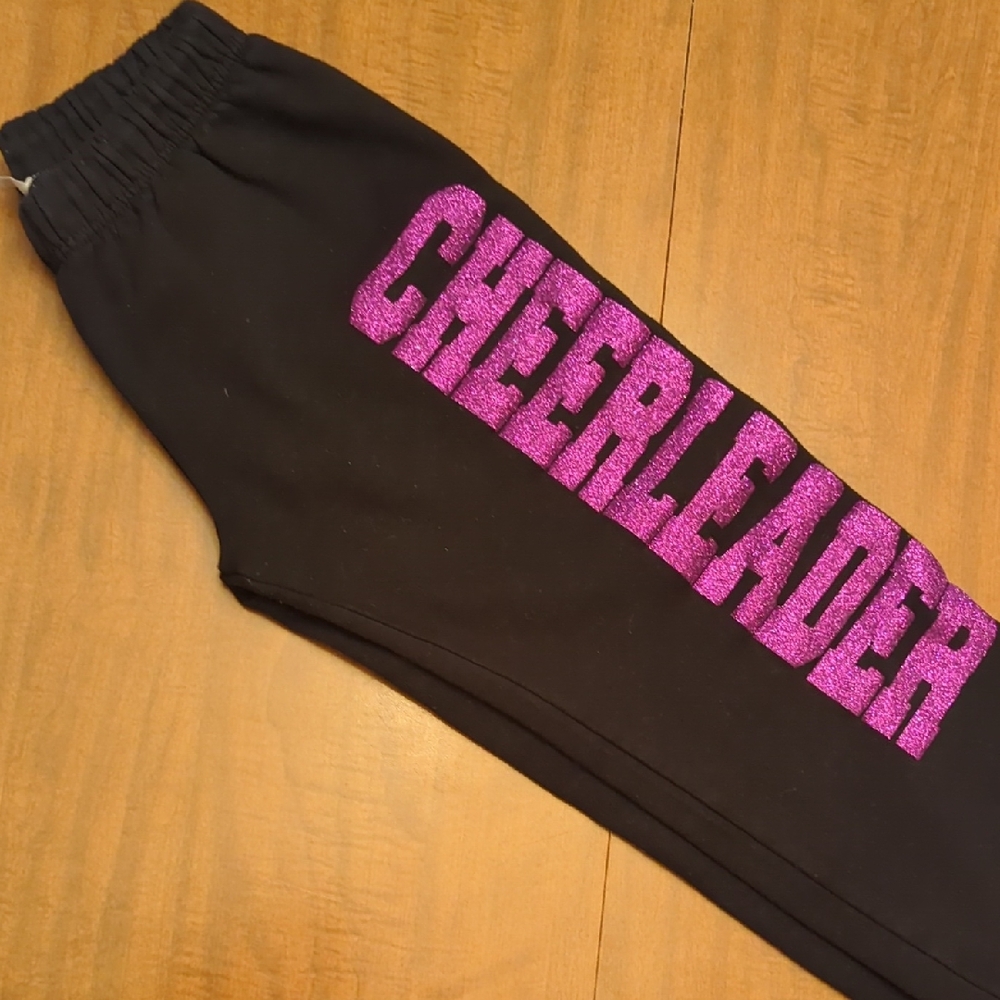 🛍️⭐ 2/$20- Black Sweatpants With "Cheerleader" In Purple Glitter Letters
